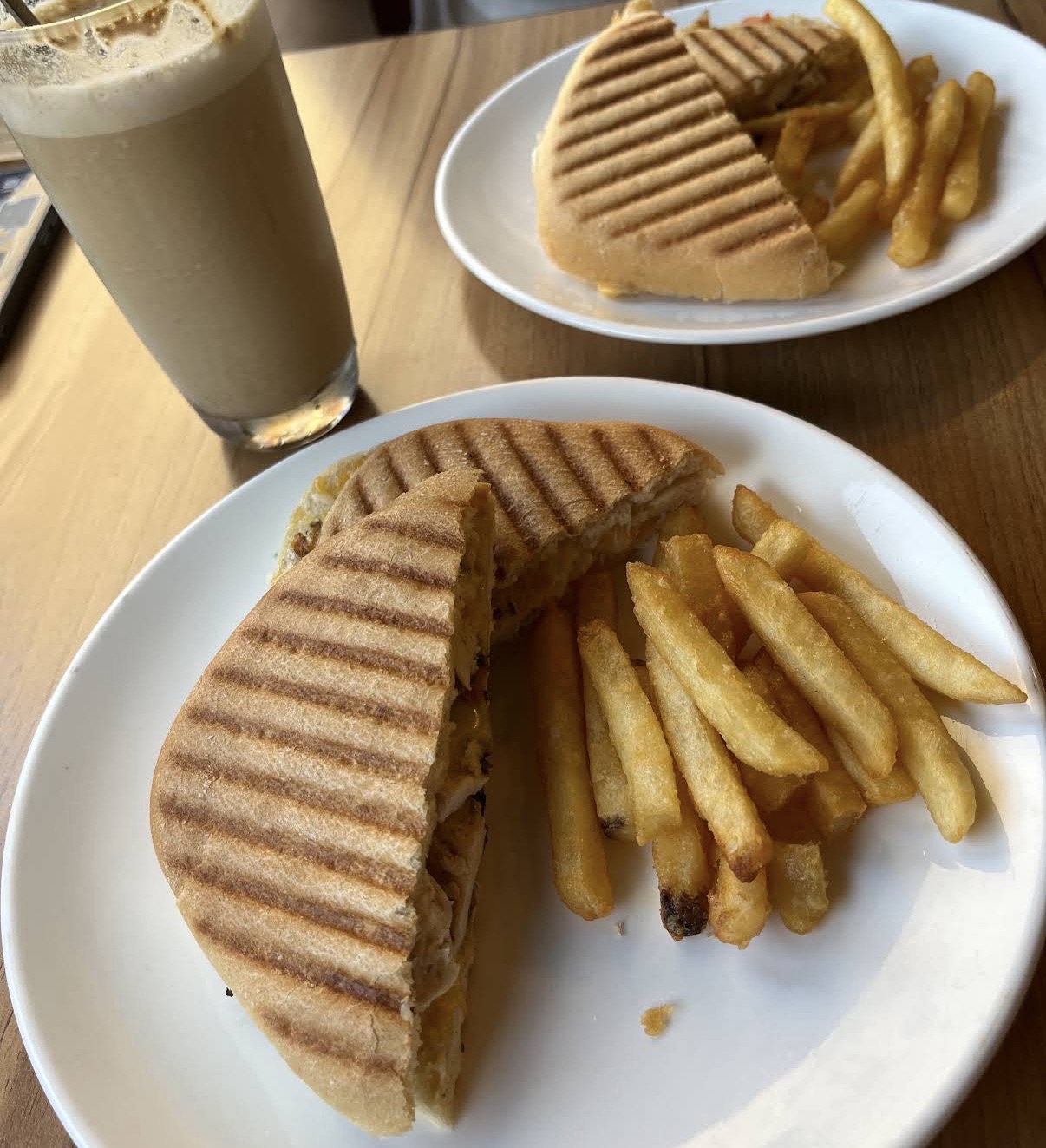 Amigos grilled panini with fries and iced coffee
